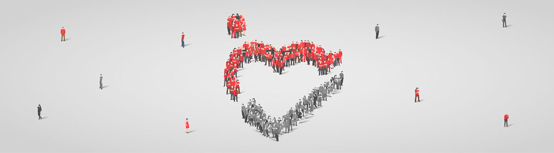 Group of people forming a heart.